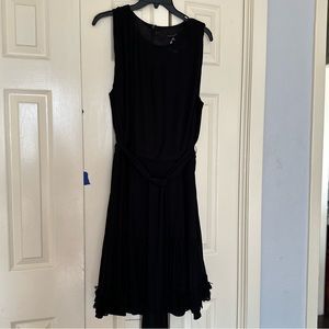 Black pleat dress with belt and flower detail hem